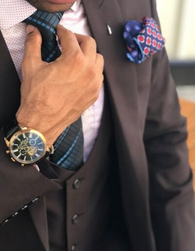 Man in Formal Suit Jacket Holding His Necktie